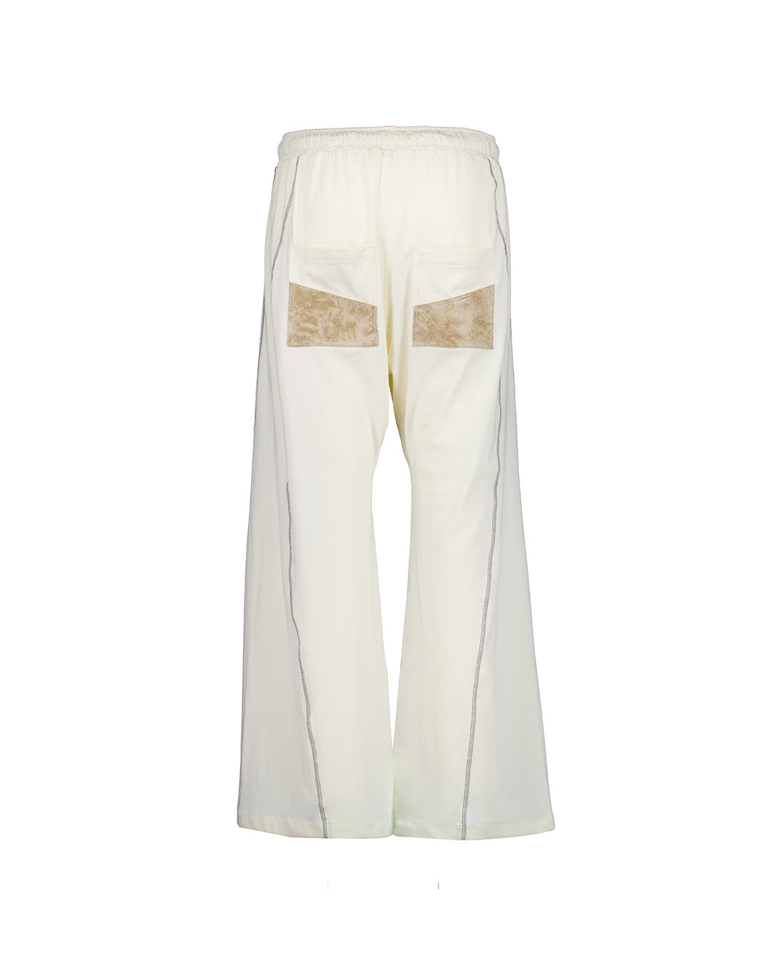 White Solid Warp Cargo Pants by KIMMICK featuring multiple pockets and a relaxed fit, shown on a model against a neutral background.