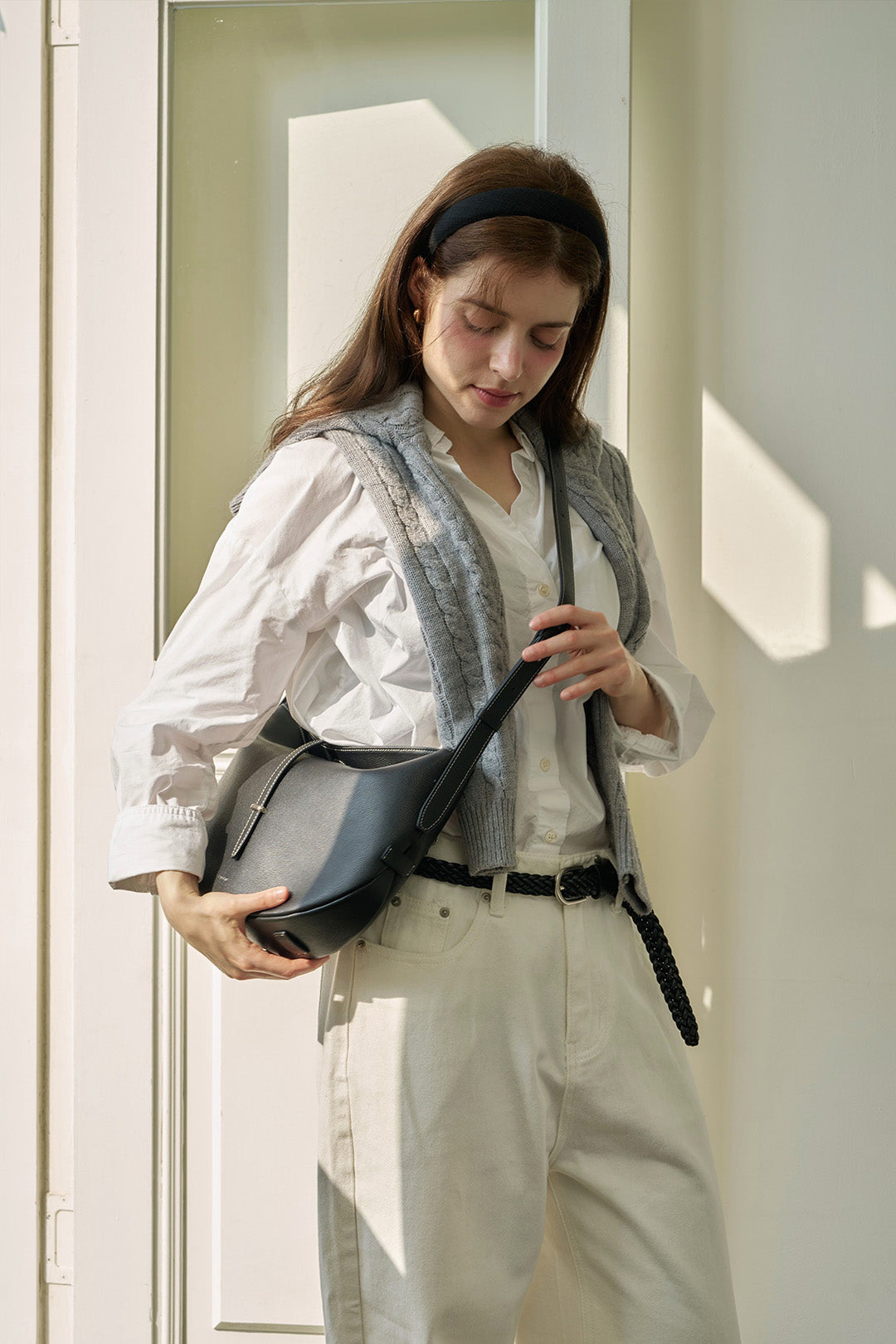 Black Shellie Hobo Bag by MIULIN featuring a soft leather design and adjustable shoulder strap.