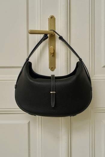 Black MIULIN Shellie Hobo Bag with soft leather, featuring a slouchy silhouette and shoulder strap for casual style.