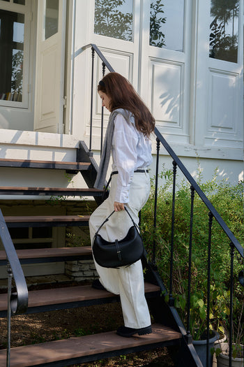 Black MIULIN Shellie Hobo Bag with adjustable strap and spacious interior, shown from side view.
