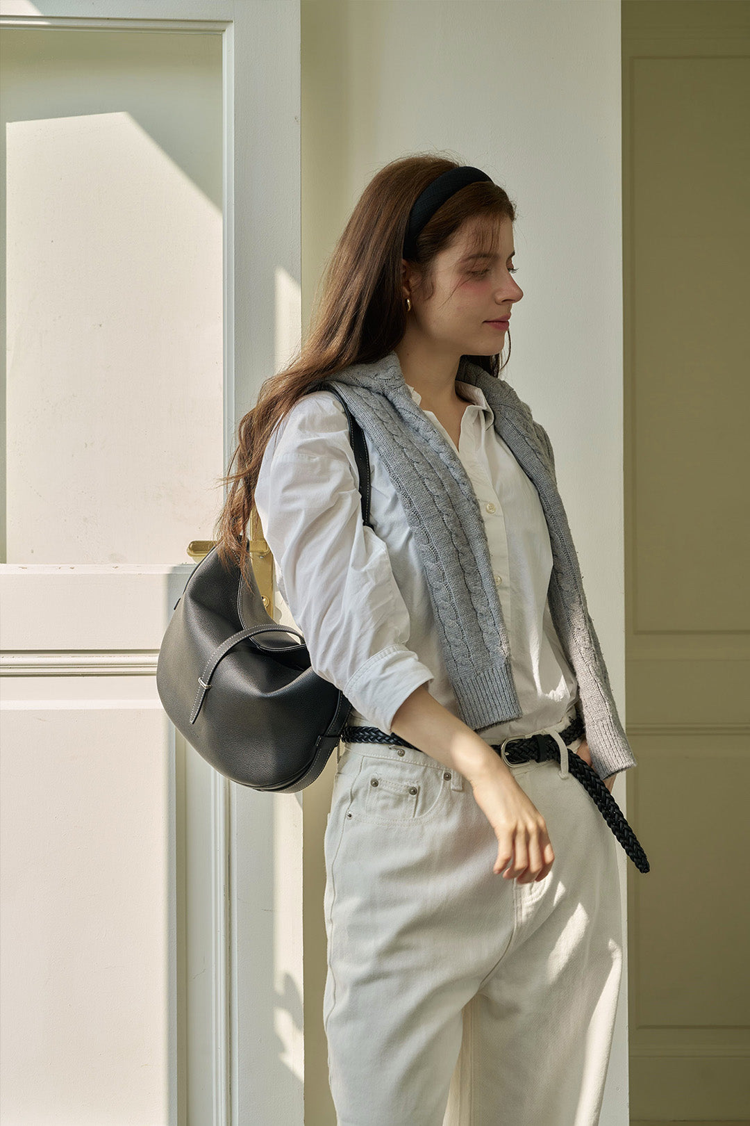 Black MIULIN Shellie Hobo Bag with shoulder strap and sleek design, shown from front view.