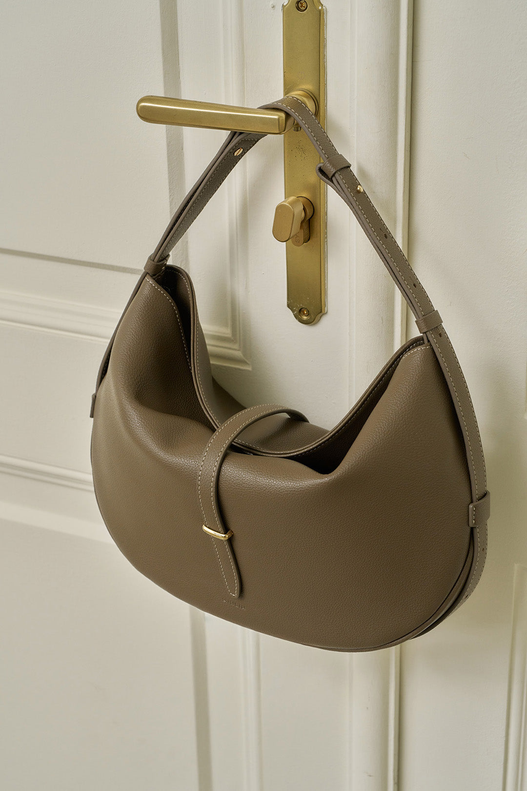 MIULIN Shellie Hobo Bag in Etoupe leather, showcasing its elegant shape and soft texture, perfect for casual or stylish outings.