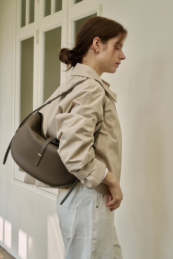 MIULIN Shellie Hobo Bag in Etoupe leather, featuring a slouchy design with subtle stitching and a shoulder strap.