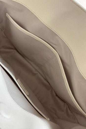 Ivory MIULIN Shellie Hobo Bag with rounded shape and shoulder strap, featuring soft textured material and minimalist design.