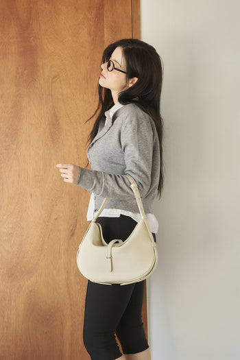 Ivory Shellie Hobo Bag by MIULIN with shoulder strap, soft leather exterior, and stylish design suitable for everyday use.