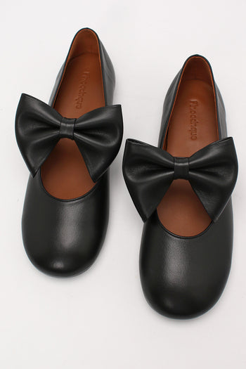Black Soo Bow Mary Jane flat shoes by Finoacinque featuring a classic design with a bow detail and comfortable slip-on style.