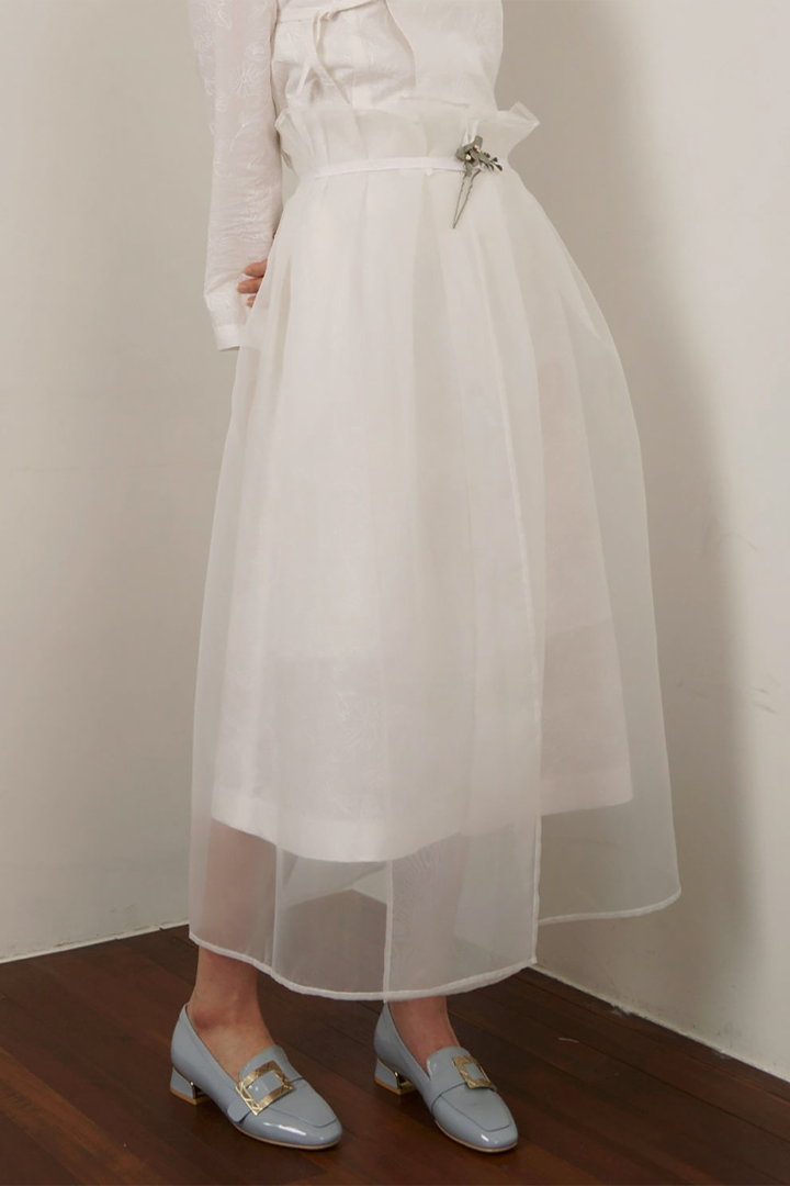 Black Charlock No-Bang See-Through Skirt by Ahhorn, lightweight and sheer, showcasing its flowy, transparent fabric design.
