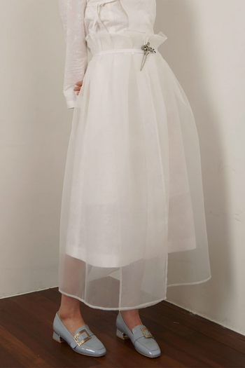 Black Charlock No-Bang See-Through Skirt by Ahhorn, lightweight and sheer, showcasing its flowy, transparent fabric design.