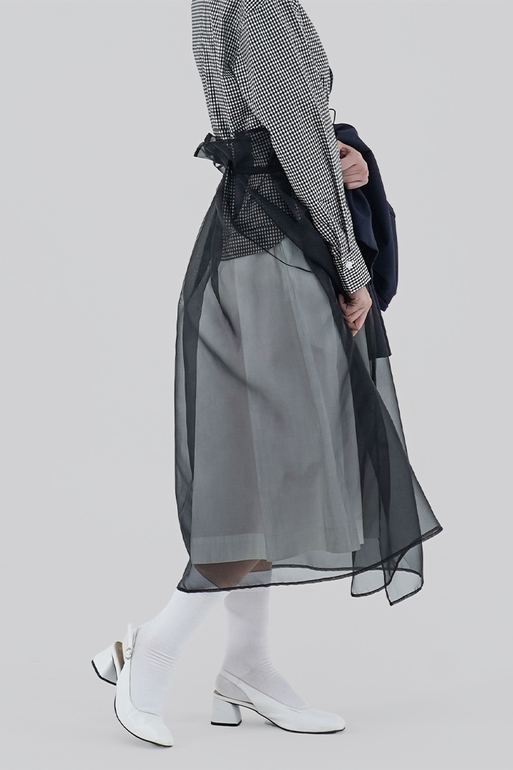Black Charlock No-Bang See-Through Skirt by Ahhorn, lightweight and sheer bottoms with a stylish, see-through design.