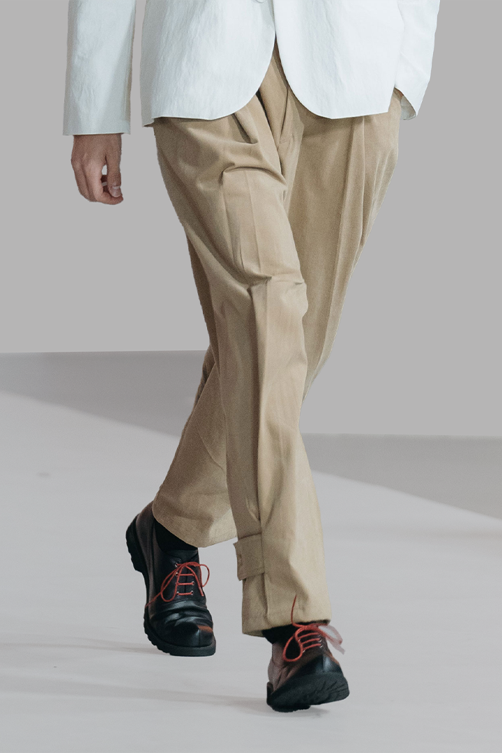 Ahhorn peach balloon double wide trousers, brown bottoms with a relaxed fit and wide-leg design, visible fabric texture.