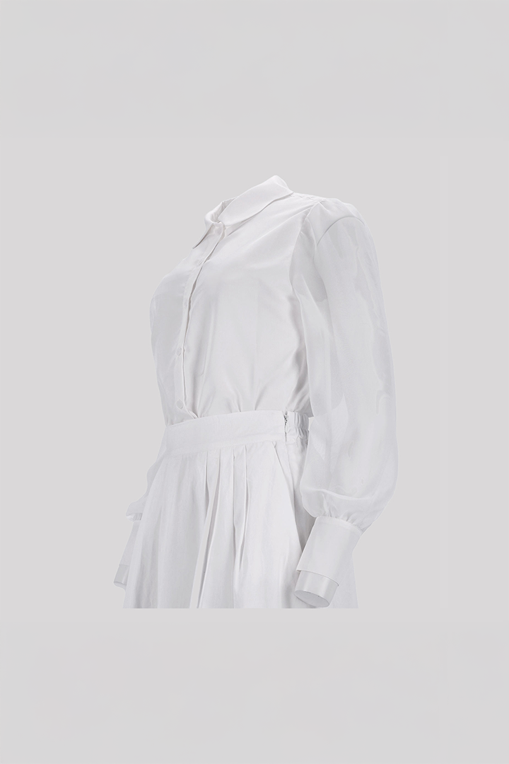 Black tile-shaped curved chiffon blouse from Ahhorn, stylish shirt with unique geometric design and flowing fabric.