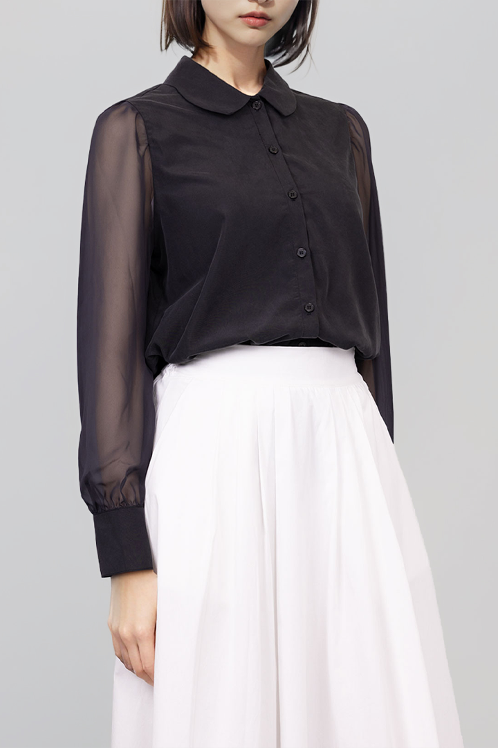 Black tile-shaped curved chiffon blouse by Ahhorn, featuring a stylish shirt design and flowing fabric.