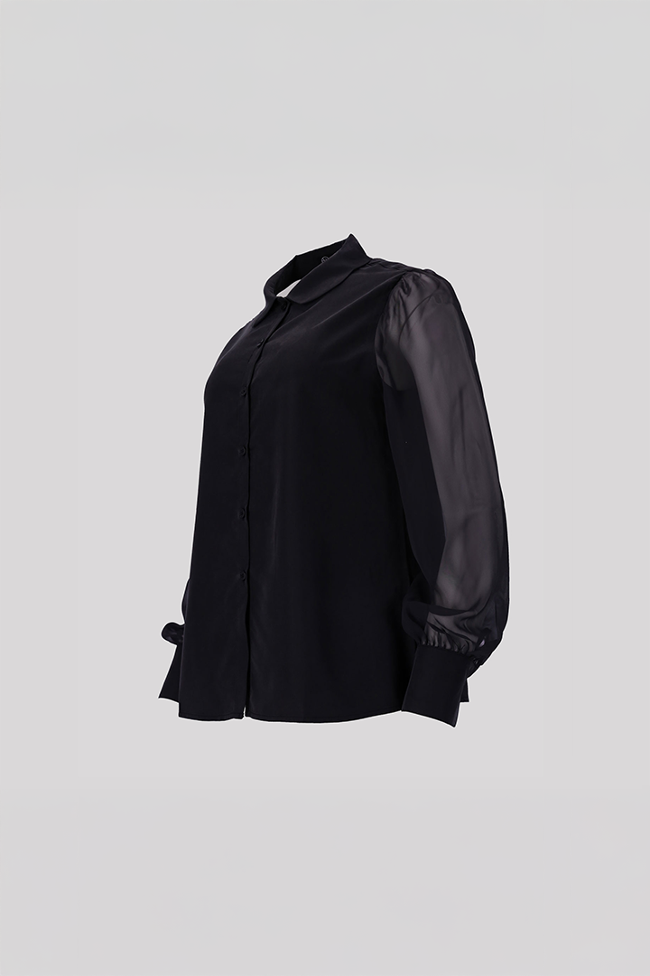 Black tile-shaped curved chiffon blouse from Ahhorn, stylish shirt with flowing fabric and unique geometric pattern.