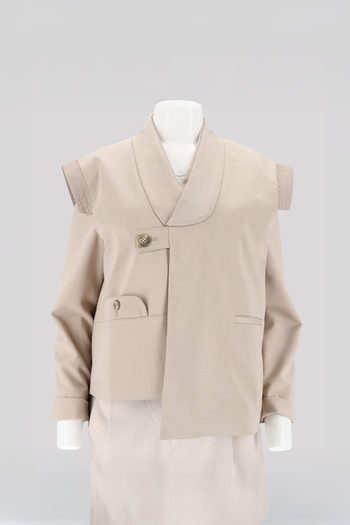 Beige quilted vest with round collar from Ahhorn, stylish tops for layering and casual wear.