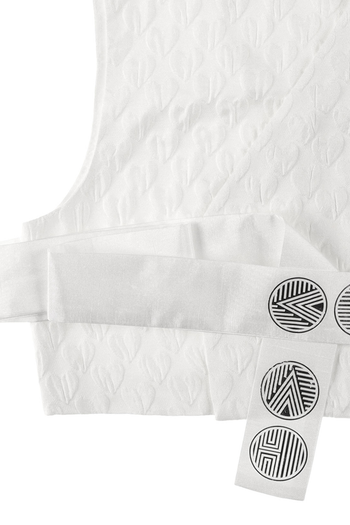 White Heart Jacquard Short Baeja Vest by Ahhorn, stylish sleeveless top with intricate heart pattern, perfect for casual wear.