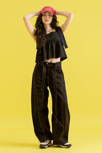 Black Chrysanthemum Knot denim pants by CCOMAQUE, stylish bottoms with unique knot detail and classic denim texture.