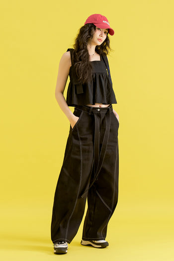 Black Chrysanthemum Knot denim pants by CCOMAQUE, stylish bottoms with unique knot detail and classic denim texture.