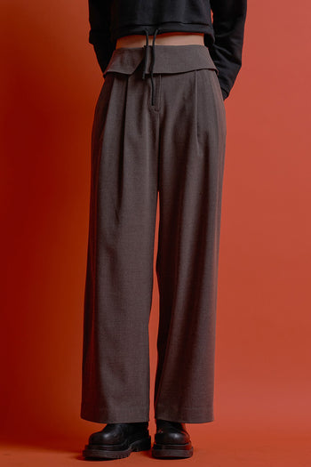Black Four-Panel Wrap Pants by CCOMAQUE, stylish bottoms with a modern layered design and comfortable fit.