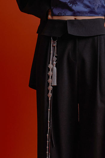 Black four-panel wrap pants from CCOMAQUE, stylish and comfortable bottoms with layered design.