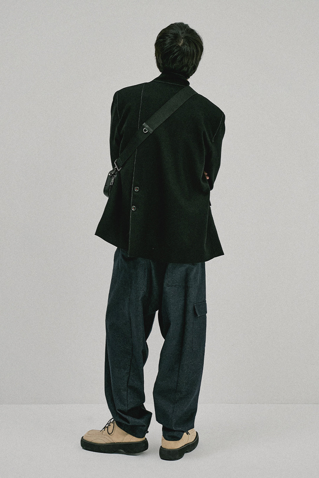 Ccomaque denim wide-leg pants in medium wash, stylish bottoms with relaxed fit and high waist, displayed on a model.