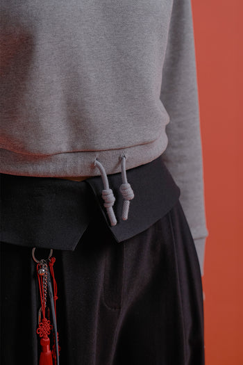 Black CCOMAQUE hoodie featuring a detailed dragon emblem on the front, casual and comfortable for everyday wear.