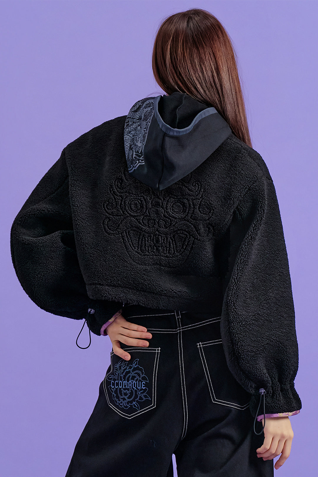 Black Gwimyeon pattern crop Jeogori jacket by CCOMAQUE, featuring traditional design and one-size fit, shown on a model.