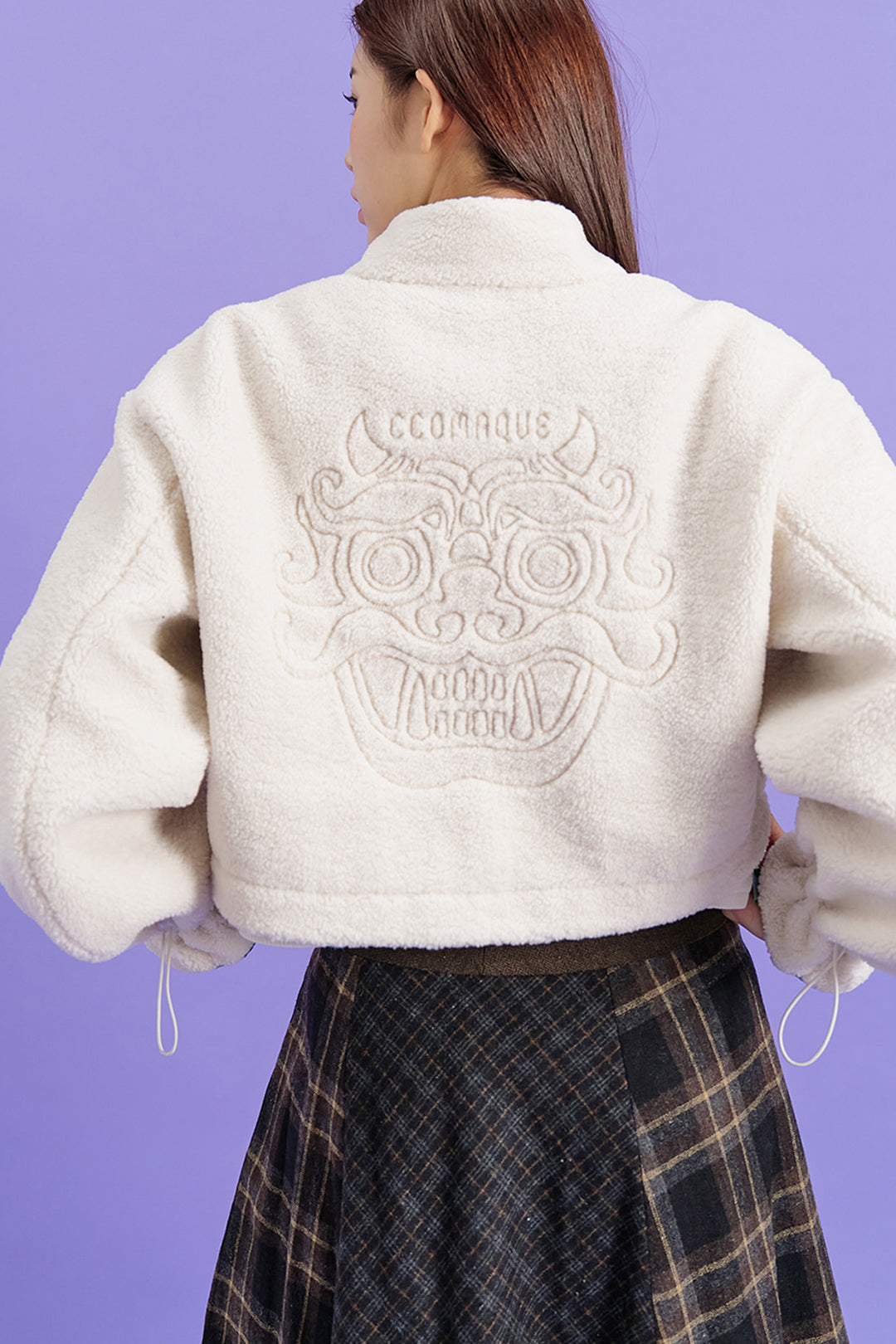 Black Gwimyeon pattern crop Jeogori jacket by CCOMAQUE, featuring traditional design and one-size fit, displayed on a hanger.