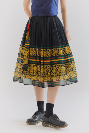 Black Seurandan chiffon skirt by CCOMAQUE, flowy and lightweight with a relaxed fit, showcased on a neutral background.