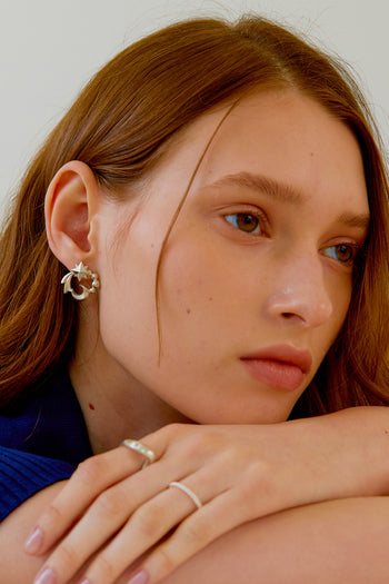 Chambriller silver Cosmos earring with a delicate design, perfect for adding a touch of elegance to your style.