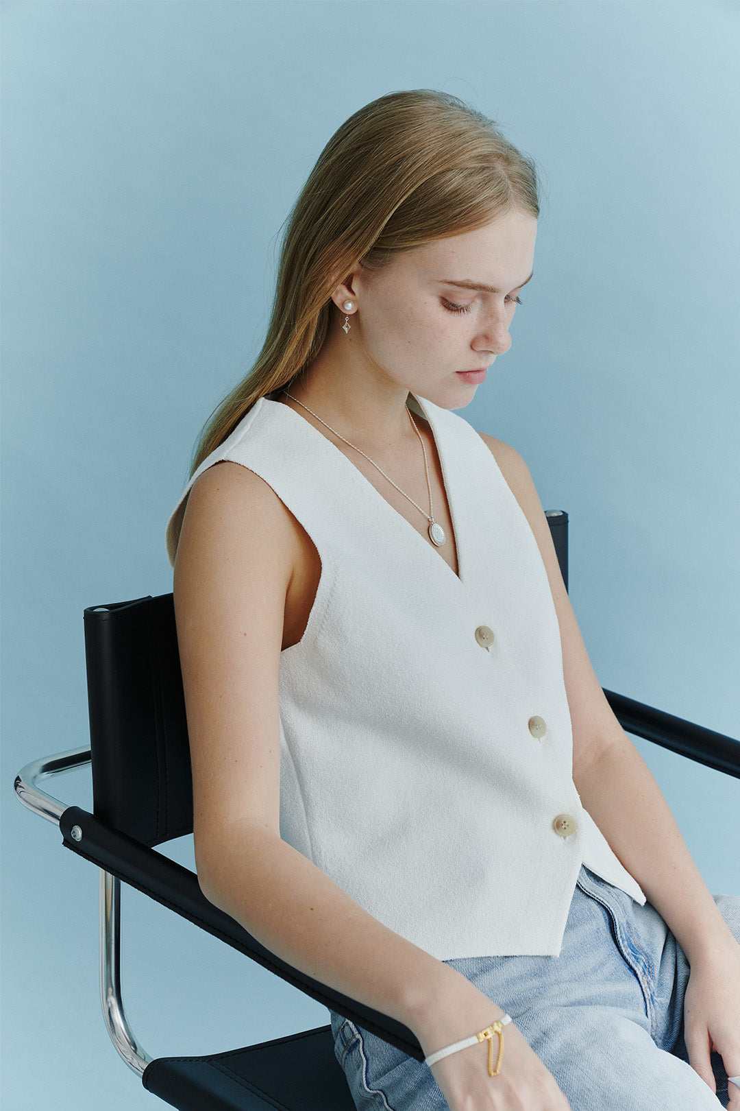 Luminous silver dangle earring by Chambriller featuring sleek, shiny design with elegant movement and modern style.