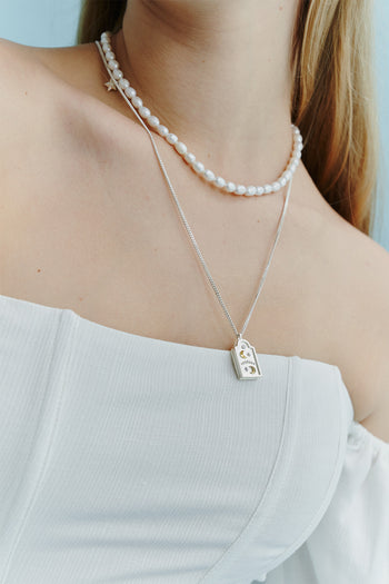 Chambriller Voyage Night Combi Necklace showcasing layered silver chains with pendant and intricate details.