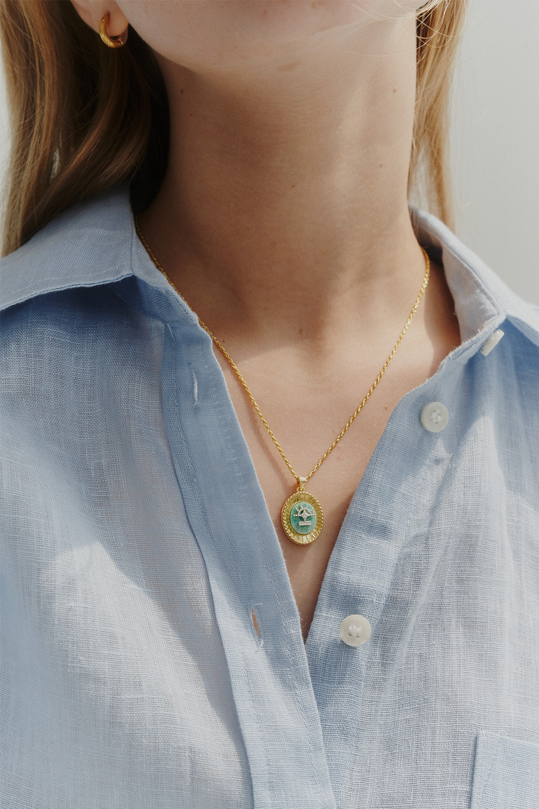 Chambriller Horizon Amazonite gold necklace with a delicate chain and vibrant blue-green gemstone pendant.