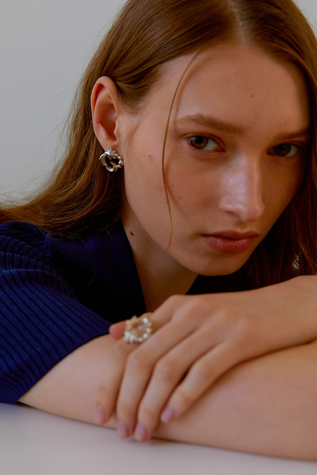 Chambriller Cosmos Silver Ring showing a sleek silver band with a detailed cosmos-inspired design, close-up view.