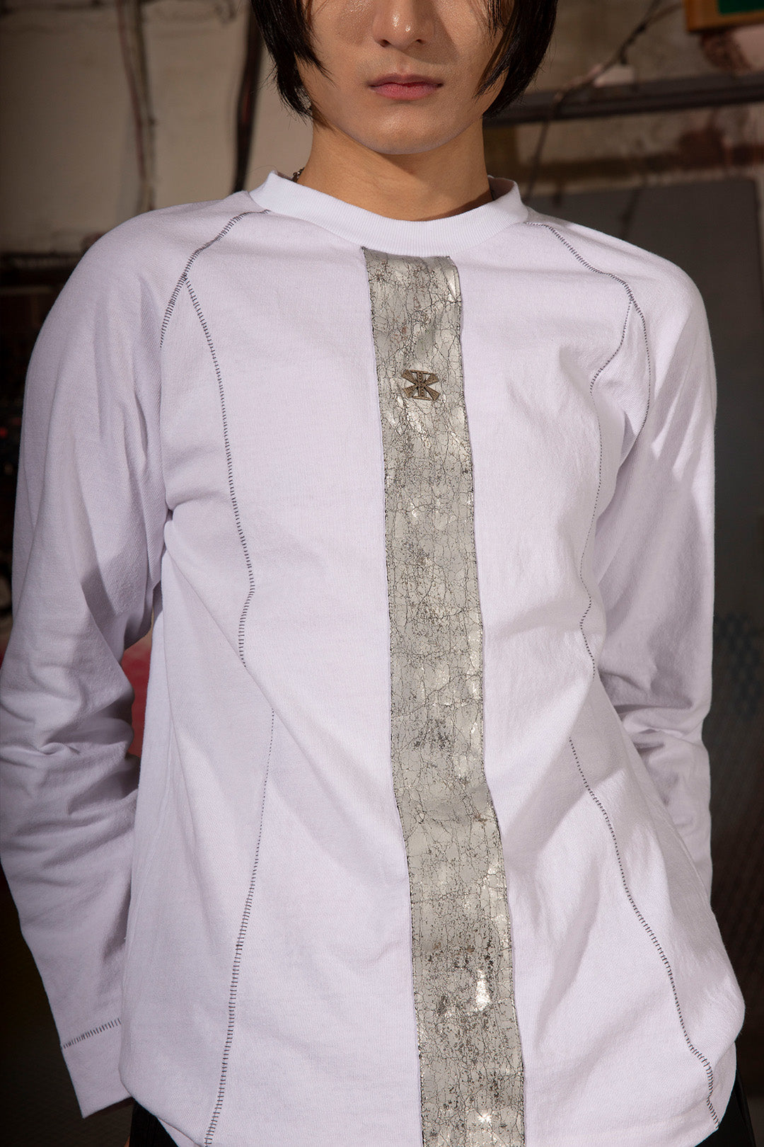 White creviced bite raglan long sleeve top by KIMMICK, featuring textured fabric and contrasting sleeve design.