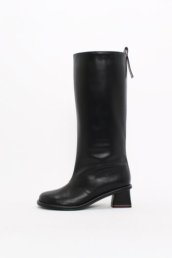 Black Moon Long Boots by Finoacinque featuring sleek leather and knee-high design with sturdy soles.