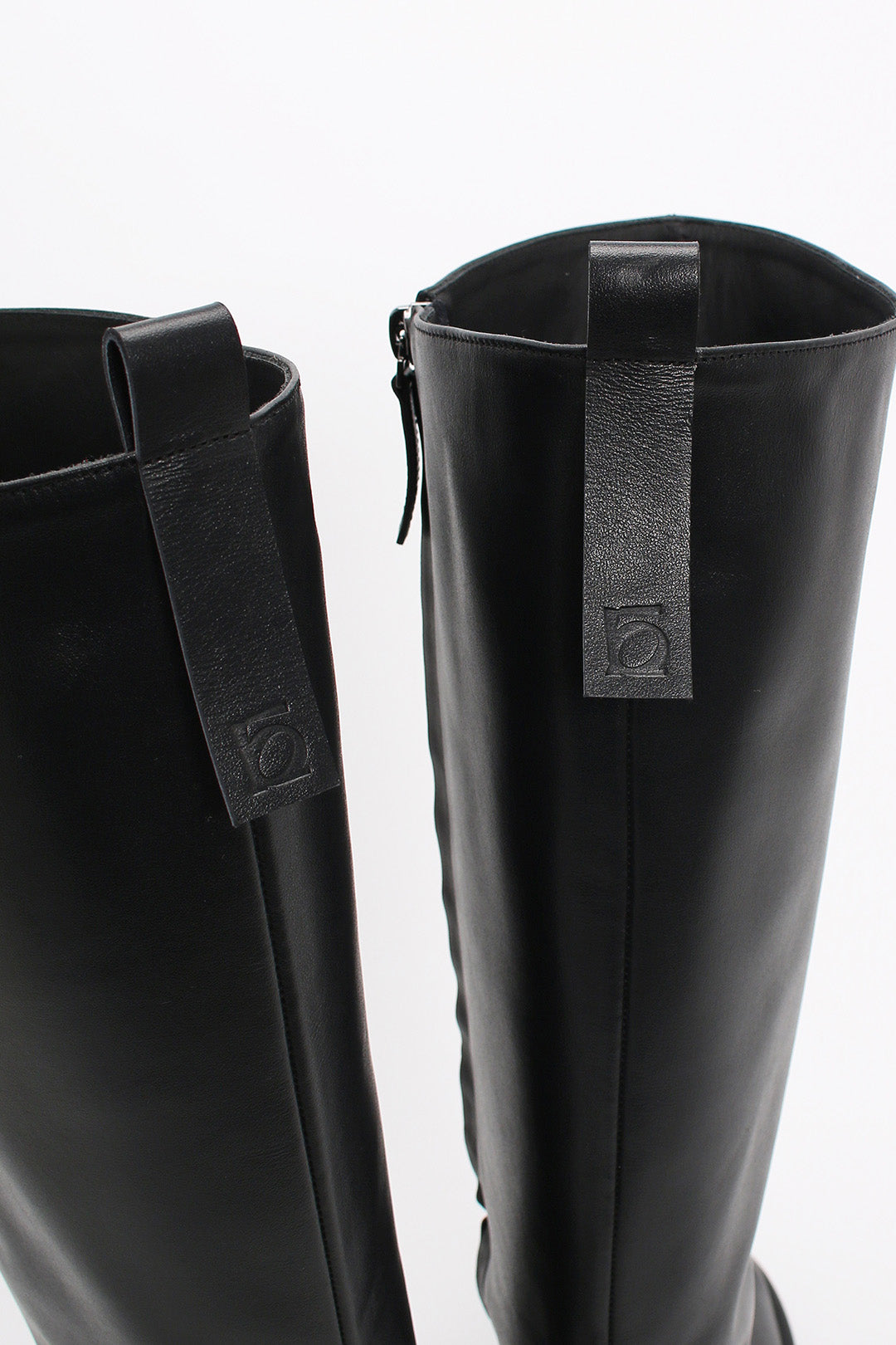 Black Moon Long Boots by Finoacinque featuring sleek design and knee-high length, perfect for stylish winter wear.