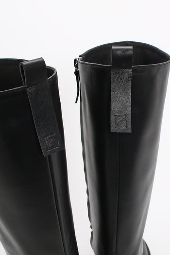 Black Moon Long Boots by Finoacinque featuring sleek design and knee-high length, perfect for stylish winter wear.