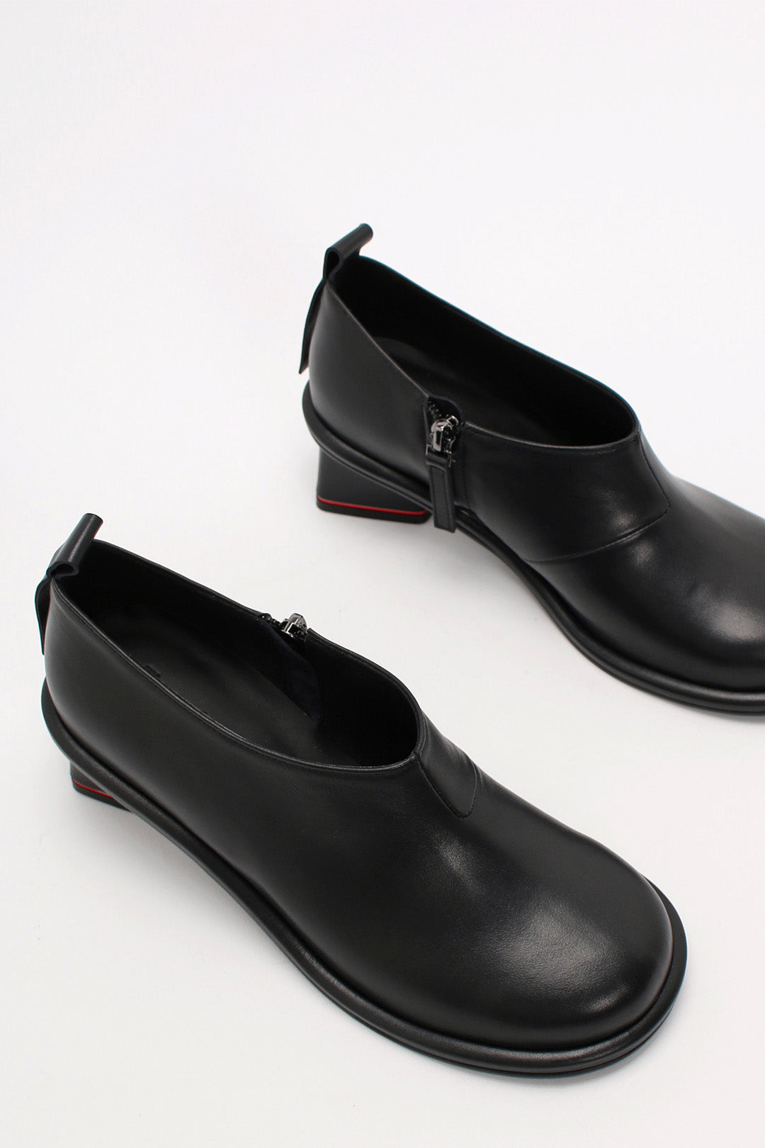 Black Moon Short Boots by Finoacinque with chunky soles and ankle-high design, stylish footwear for casual or night-out looks.