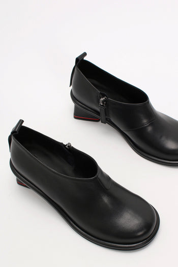Black Moon Short Boots by Finoacinque with chunky soles and ankle-high design, stylish footwear for casual or night-out looks.