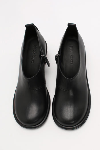 Black Moon Short Boots by Finoacinque featuring a sleek silhouette and stylish design, shown on a model.