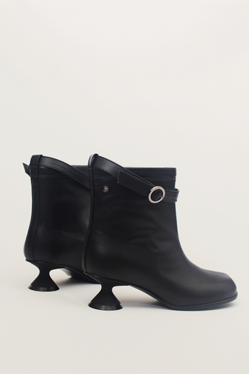 Black Uhjeo Hourglass Middle Heel Strap Boots by Finoacinque featuring ankle-high design and stylish strap details.