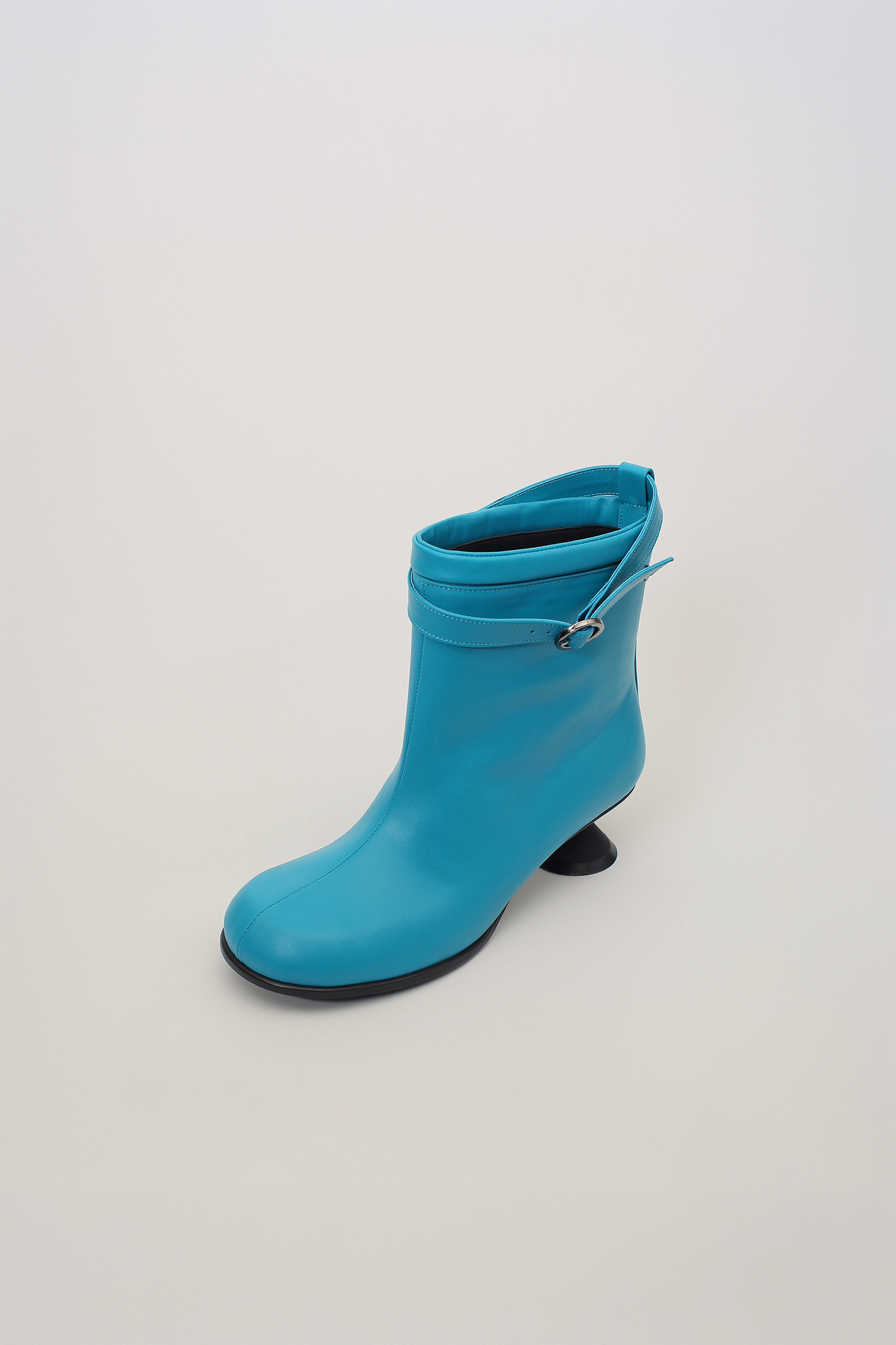 Blue Uhjeo Hourglass Middle Heel Strap Boots by Finoacinque featuring stylish ankle straps and a sleek design.