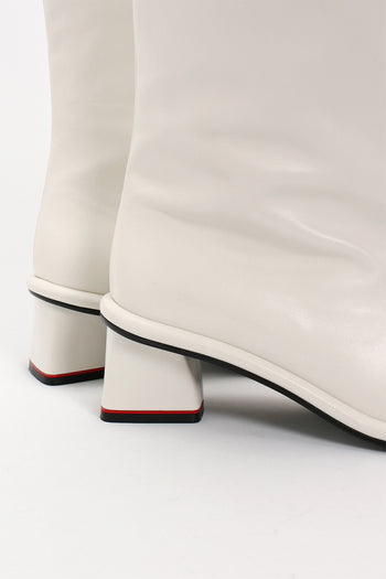 Finoacinque ivory Moon Long Boots showcasing tall, stylish boots with a sleek design and pointed toe.