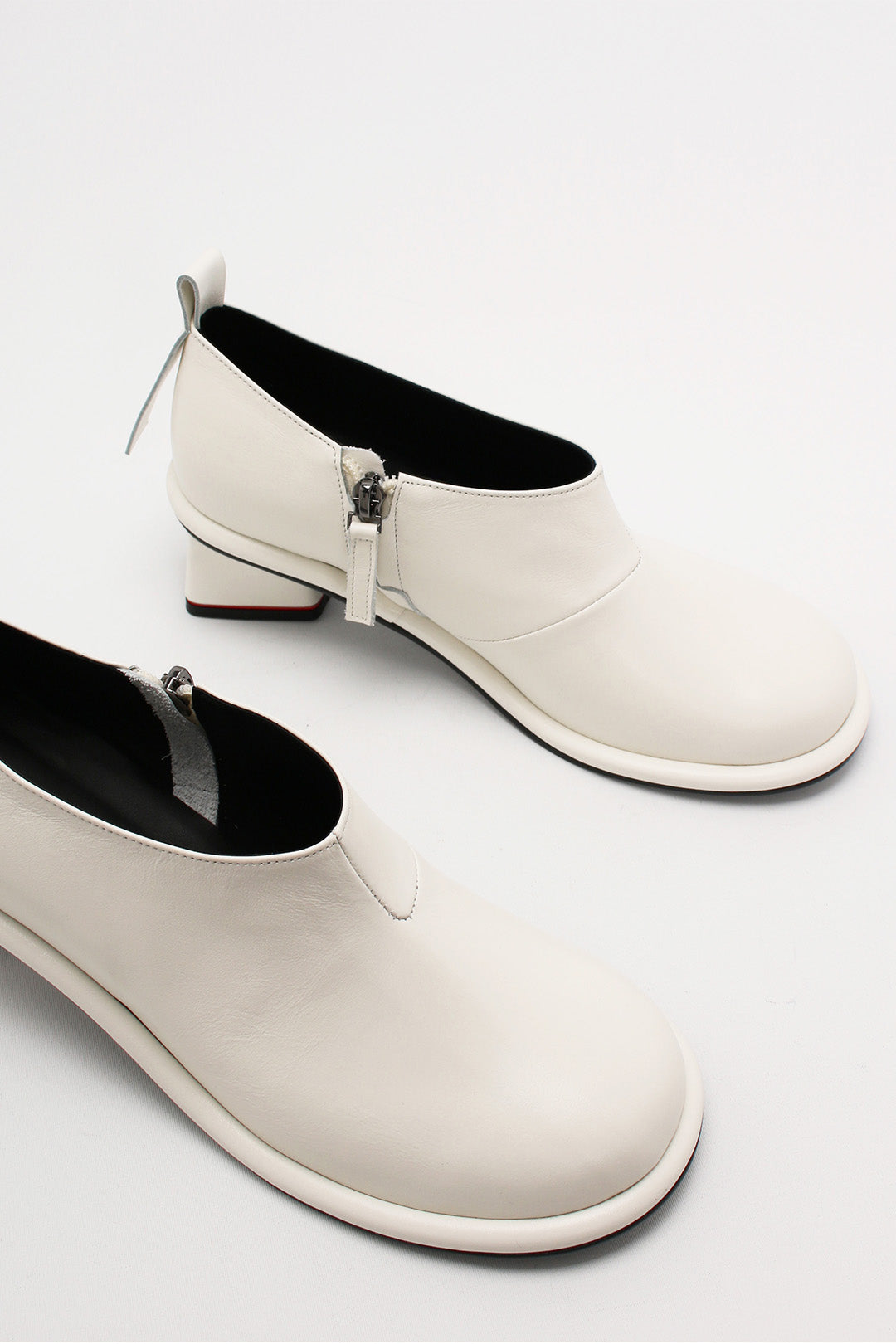 Ivory Moon Short Boots by Finoacinque featuring a sleek design and ankle-high style, perfect for casual or chic outfits.