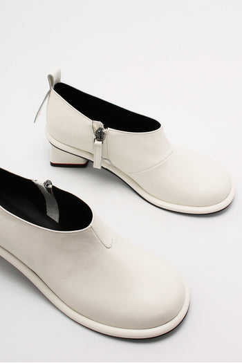 Ivory Moon Short Boots by Finoacinque featuring a sleek design and ankle-high style, perfect for casual or chic outfits.