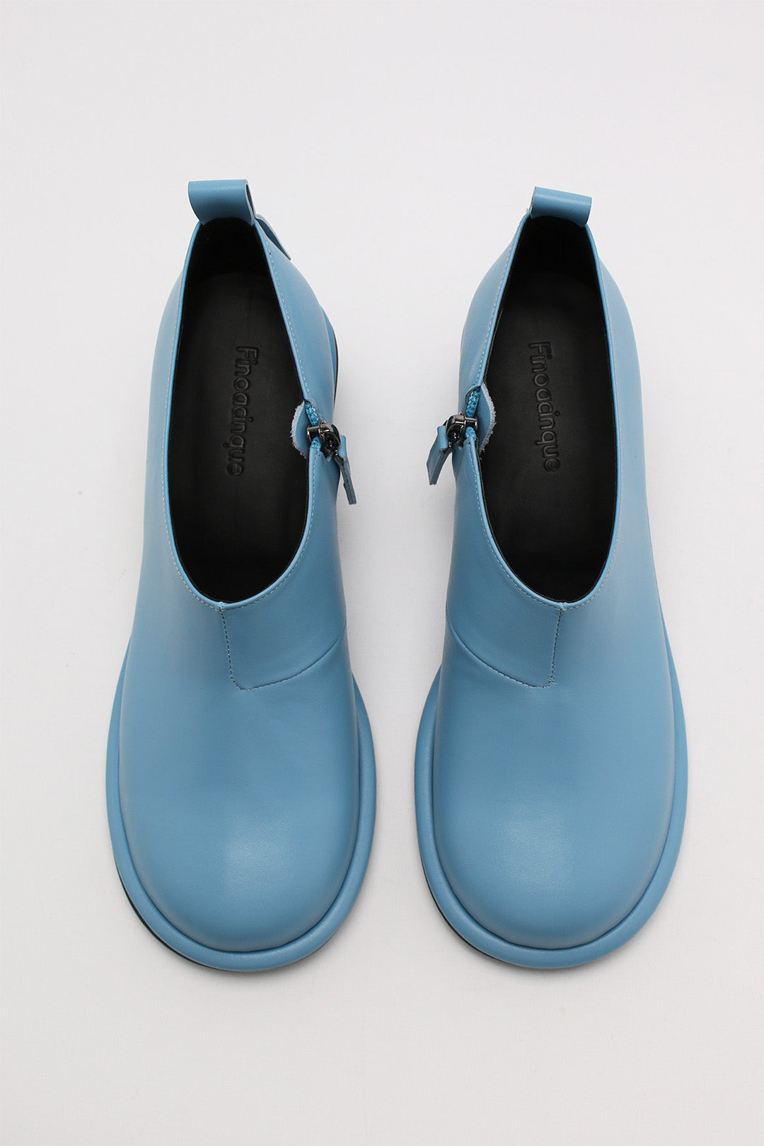Light blue Moon Short Boots by Finoacinque with a sleek design and stylish silhouette, perfect for casual wear.