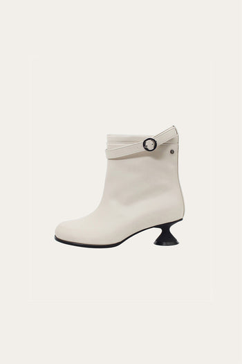 White Uhjeo Hourglass Middle Heel Strap Boots by Finoacinque with ankle straps and sleek design, shown from the side.