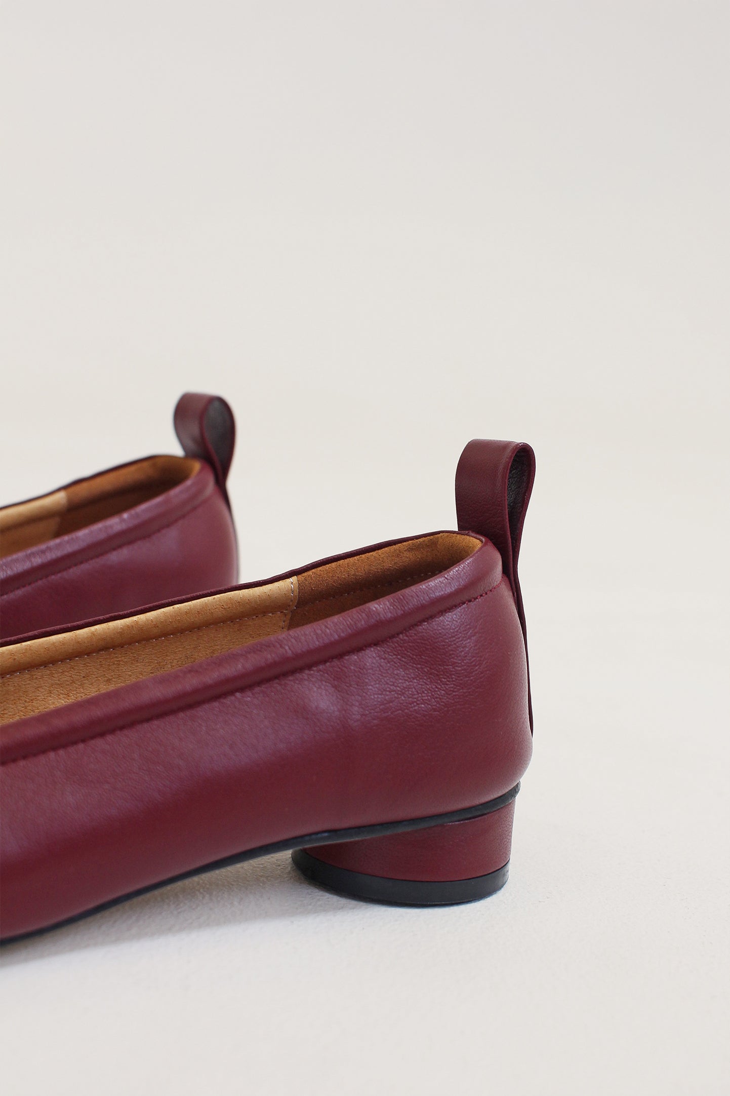 Finoacinque Ngela burgundy round toe stopper flat shoes with sleek design and comfortable flat sole.