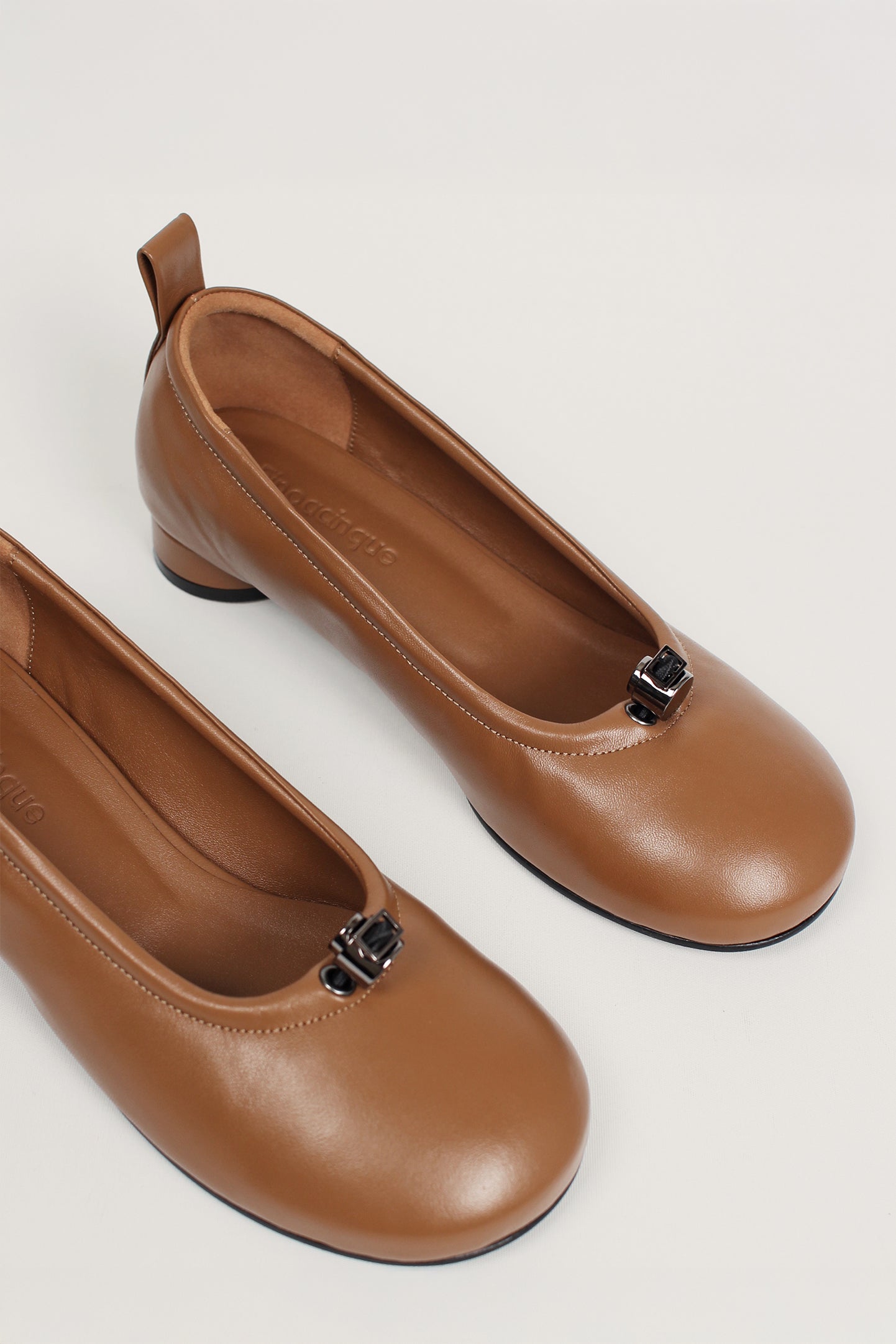Finoacinque Ngela cognac round toe stopper flat shoes with a sleek, minimalist design and smooth leather finish.