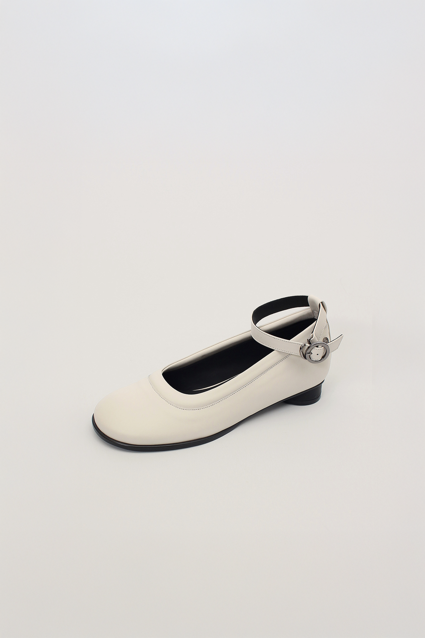 White Uhjeo Strap Flat Shoes by Finoacinque featuring a sleek flat design and comfortable strap detail.